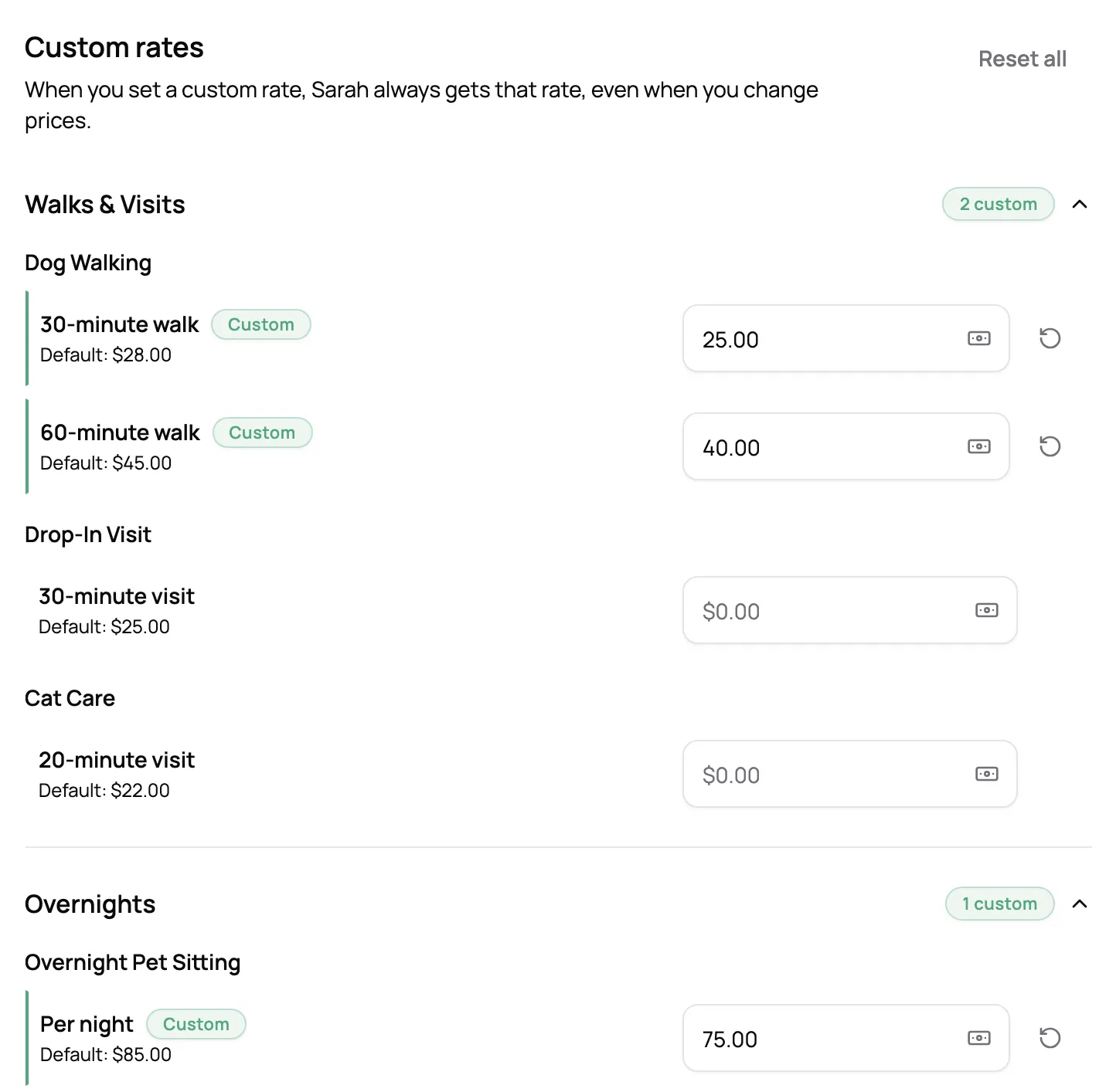 A client’s Rates tab with custom prices for walks and overnights, each above the business’s default price